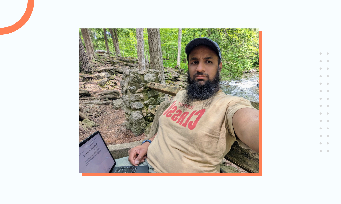 Hussain working outdoors by the brook