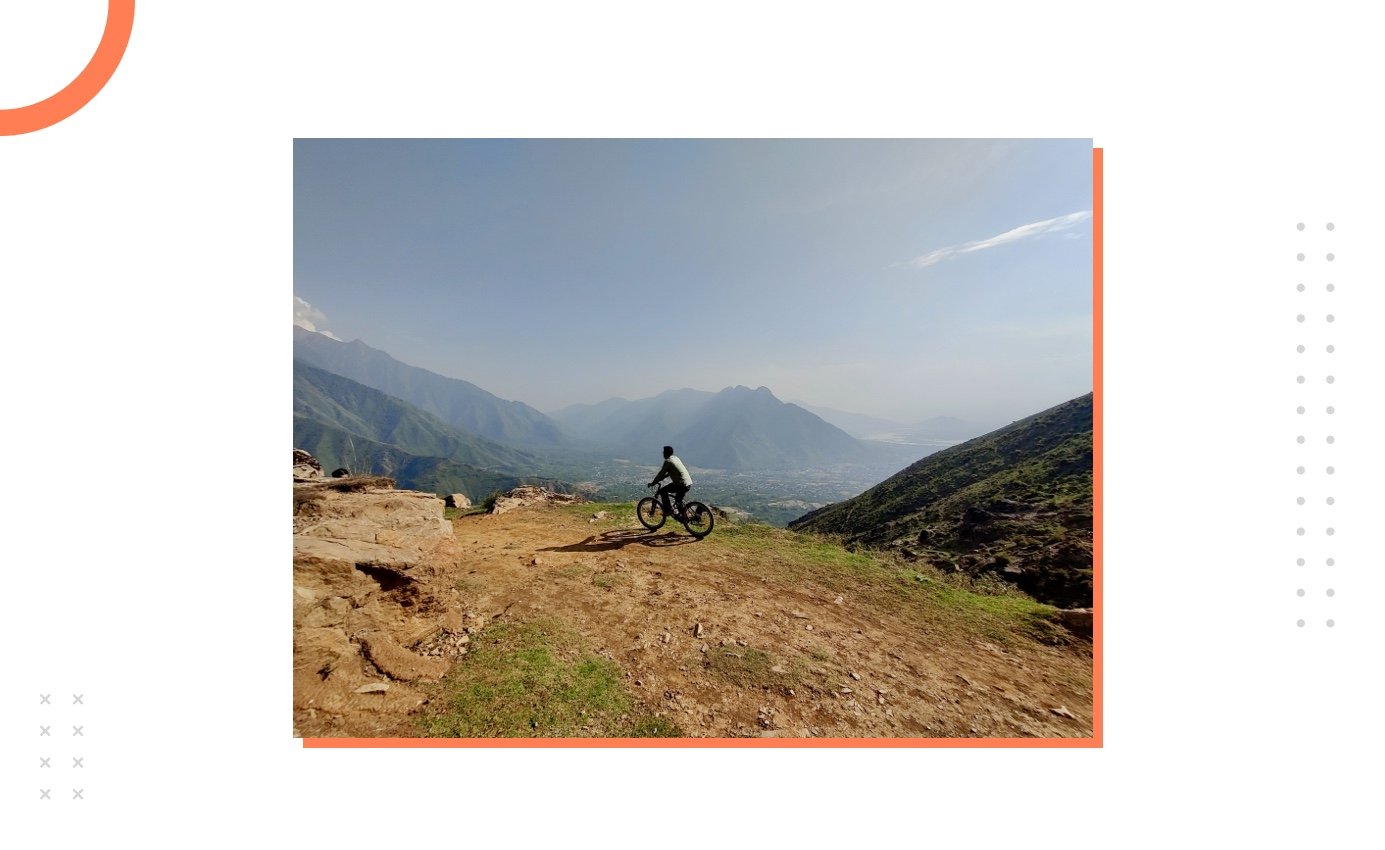 Hamid cycling on a mountain peak