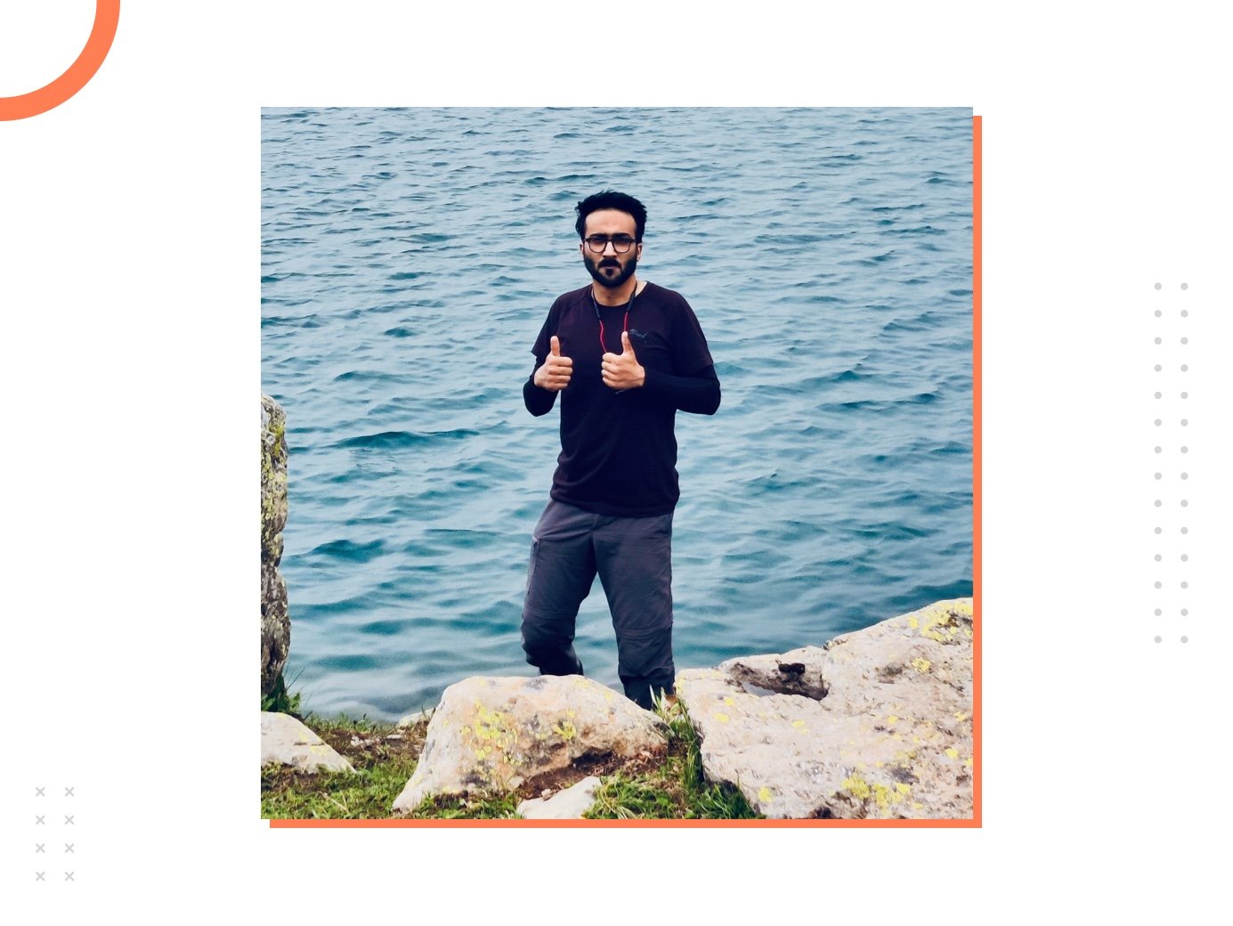 Hamid standing near a lake